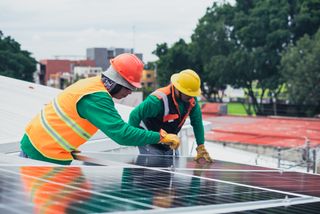 Workers installing a solar array.